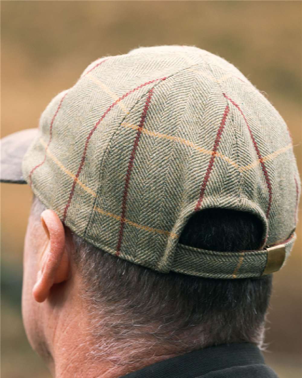 Tweed coloured Jack Pyke Baseball Hat on blurry background 