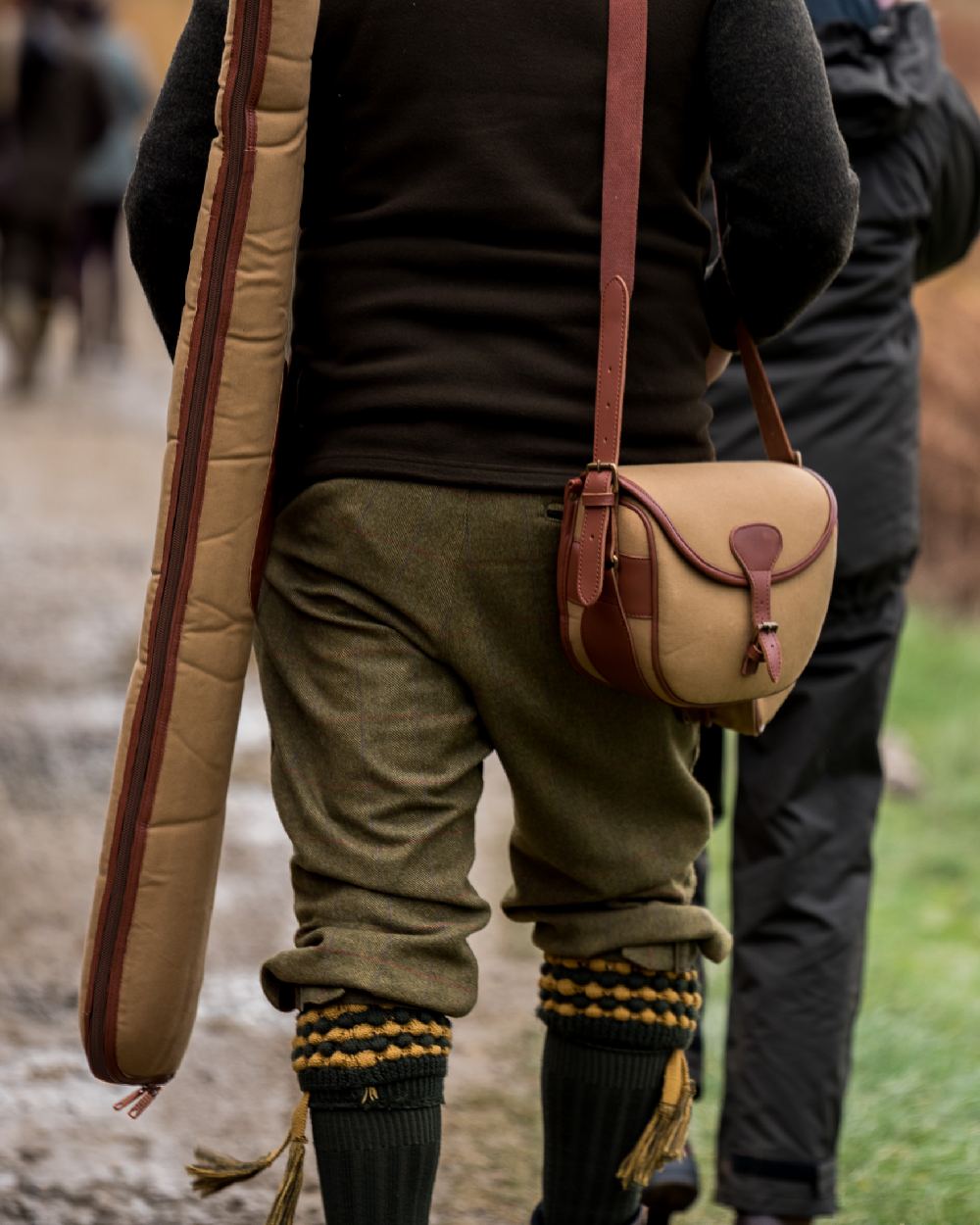 Fawn coloured Jack Pyke Canvas Cartridge Bag on blurry background 