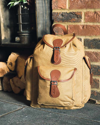 Fawn coloured Jack Pyke Canvas Day Pack on wall background 