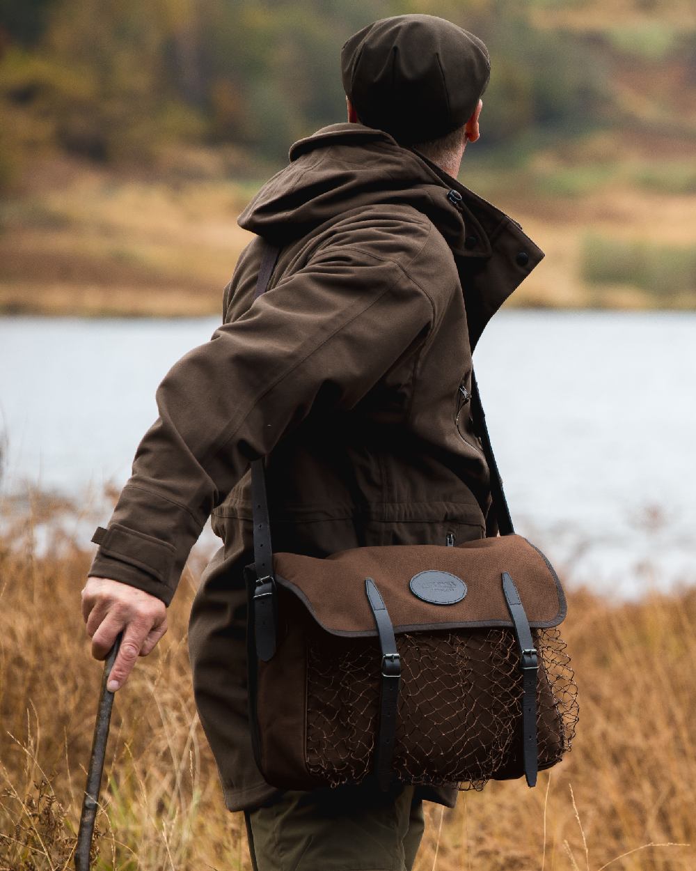 Brown coloured Jack Pyke Canvas Game Bag on grassy background 