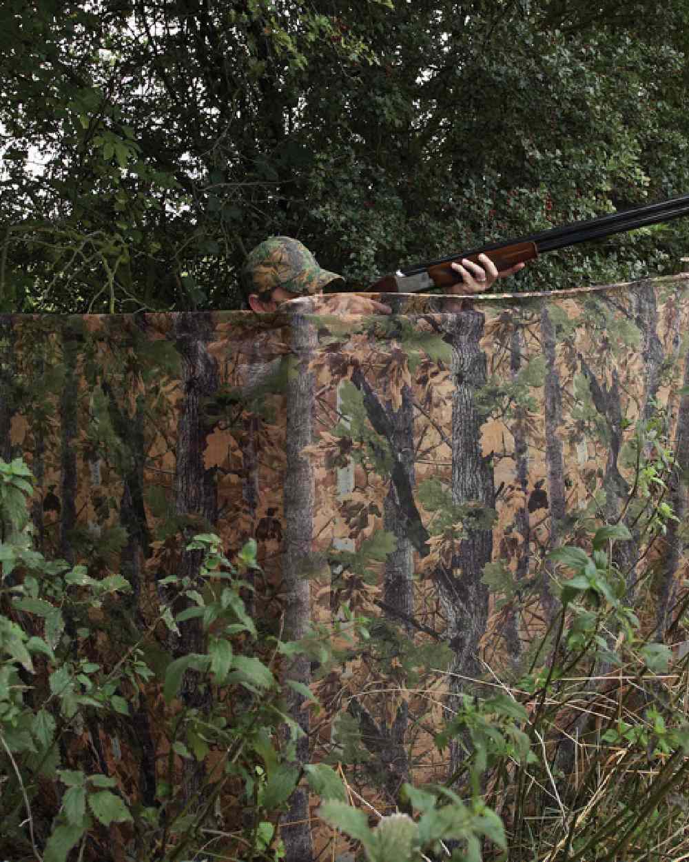 EVO coloured Jack Pyke Clearview Hide Net on forest background 