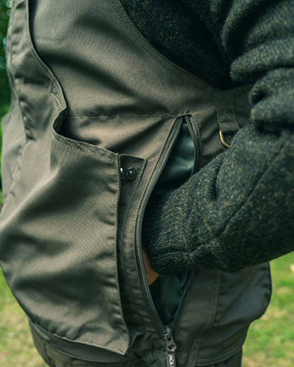 Olive Green coloured Jack Pyke Countryman Vest on grass background 