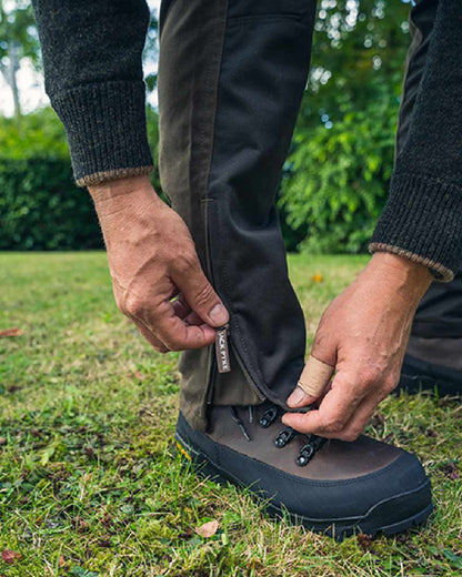 Contrast Green coloured Jack Pyke Fieldman Trousers on grass background 