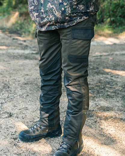 Contrast Green coloured Jack Pyke Fieldman Trousers on soil background 