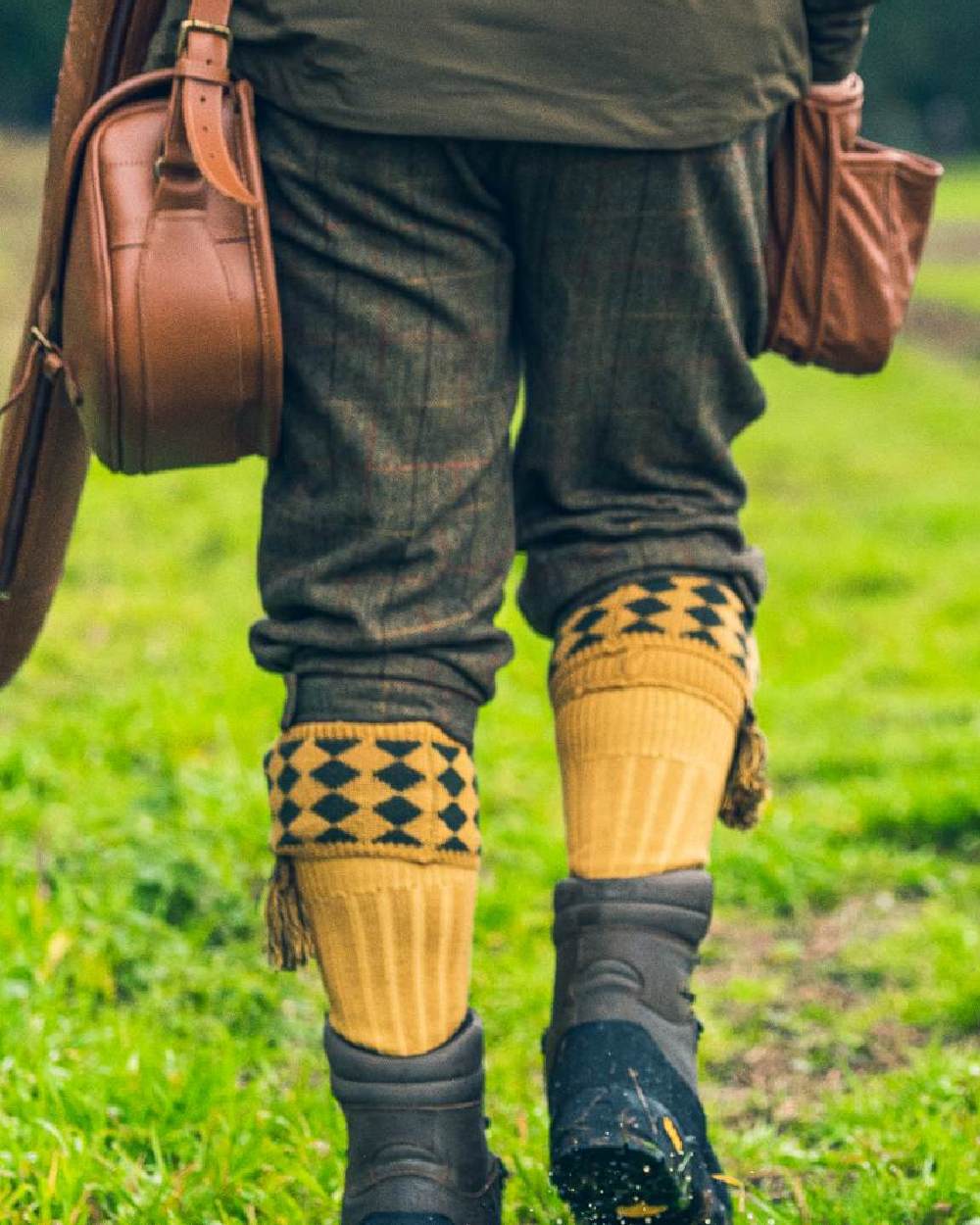 Mustard coloured Jack Pyke Harlequin Socks on grass background 