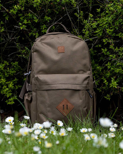 Olive Brown coloured Jack Pyke Harrier Rucksack on garden background 