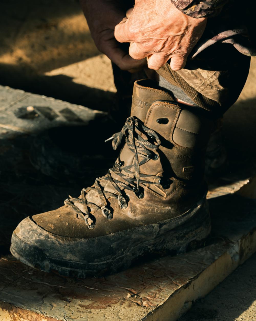 Brown coloured Jack Pyke Hunters Boots on outdoor background 