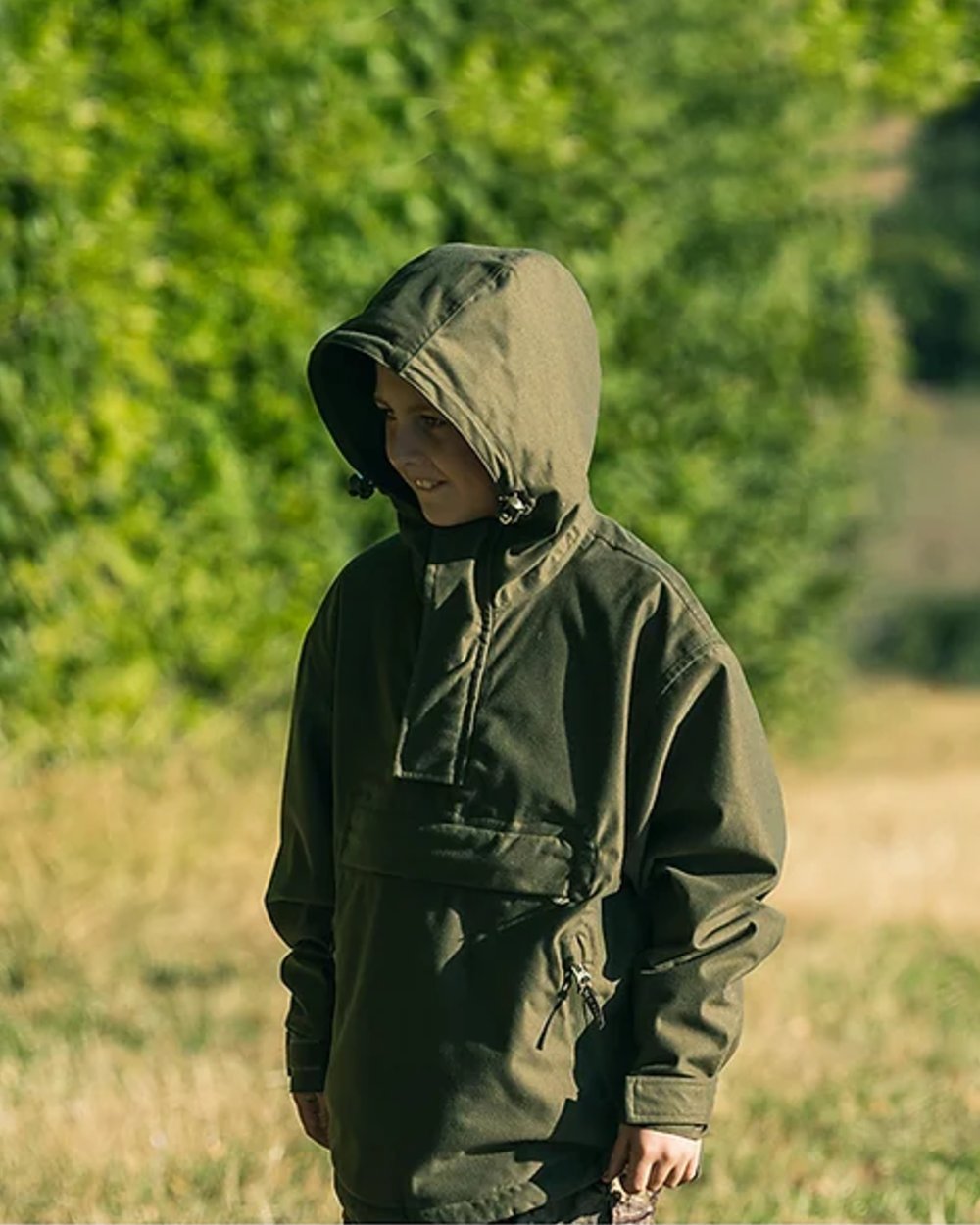 Green coloured Jack Pyke Junior Galbraith Smock on forest background 