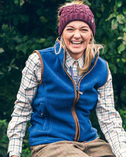 Denim coloured Jack Pyke Ladies Countryman Fleece Gilet on leafy background 