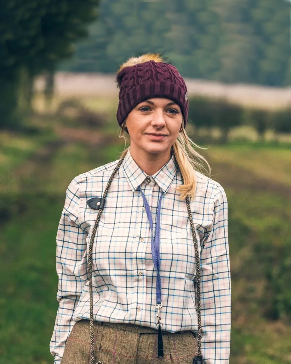 Navy coloured Jack Pyke Ladies Countryman Shirt on blurry background 