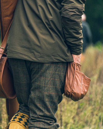 Tan coloured Jack Pyke Leather Cartridge Pouch on forest background 