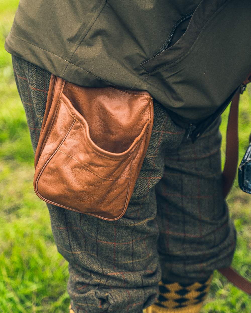 Tan coloured Jack Pyke Leather Cartridge Pouch on grass background 