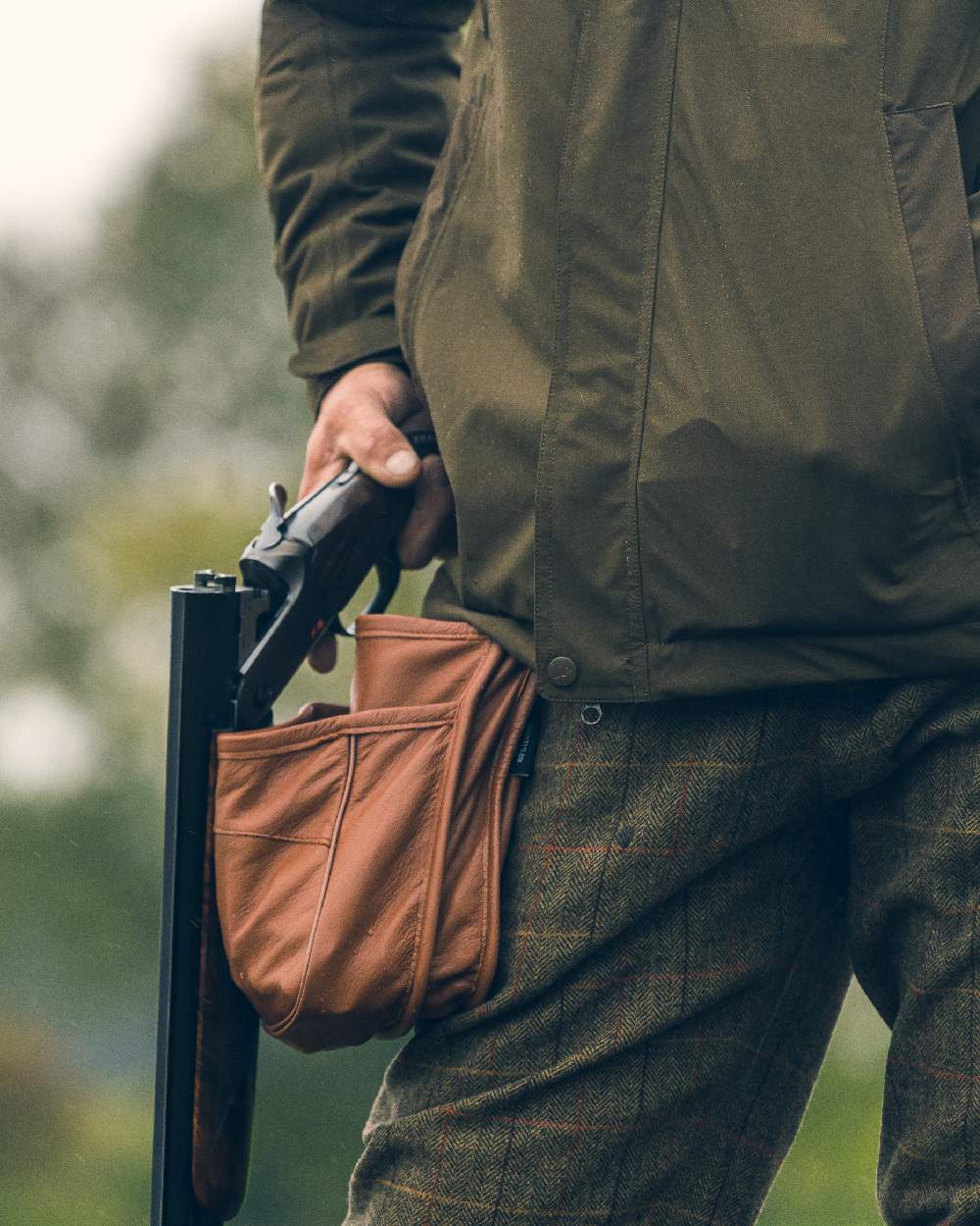 Tan coloured Jack Pyke Leather Cartridge Pouch on blurry background 