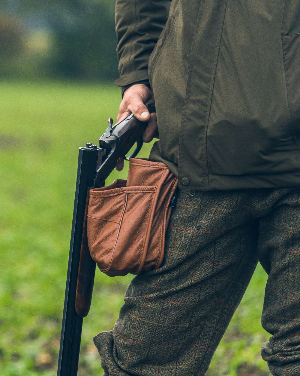 Tan coloured Jack Pyke Leather Cartridge Pouch on blurry background 