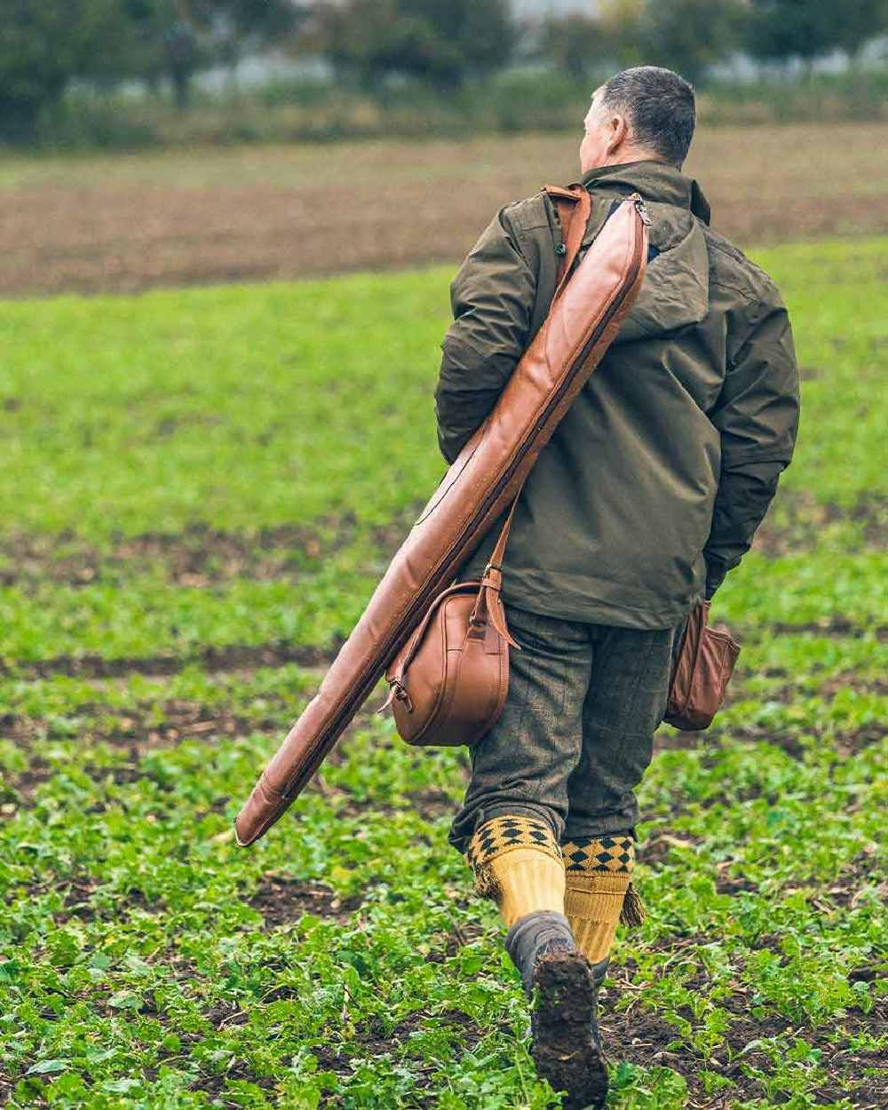 Tan coloured Jack Pyke Leather Shotgun Slip on grassy background 