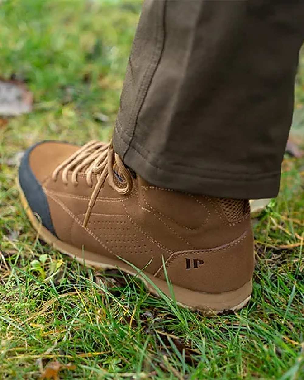 Brown coloured Jack Pyke Lowland Boots on grassy background 