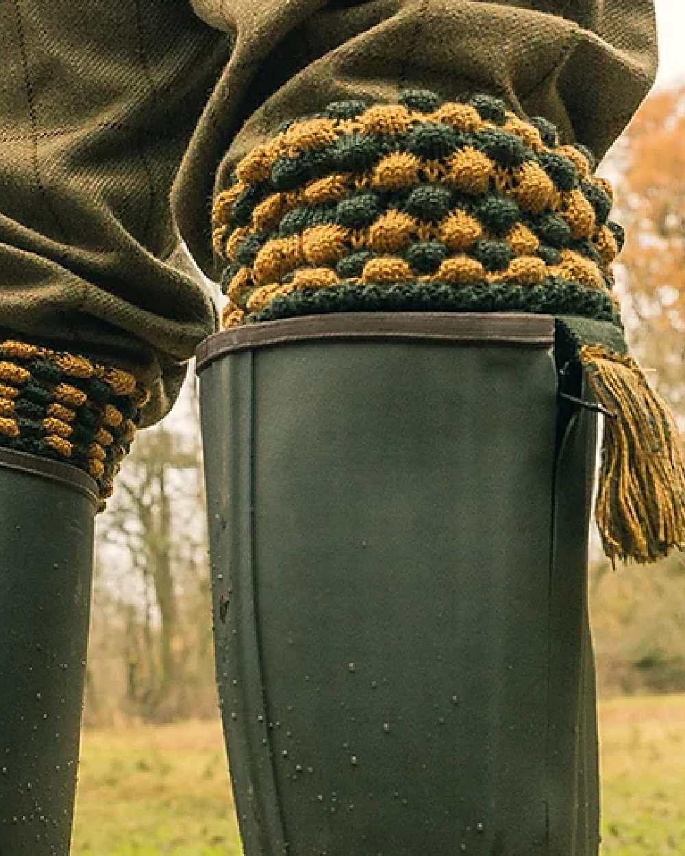 Green coloured Jack Pyke Pebble Socks on blurry background 