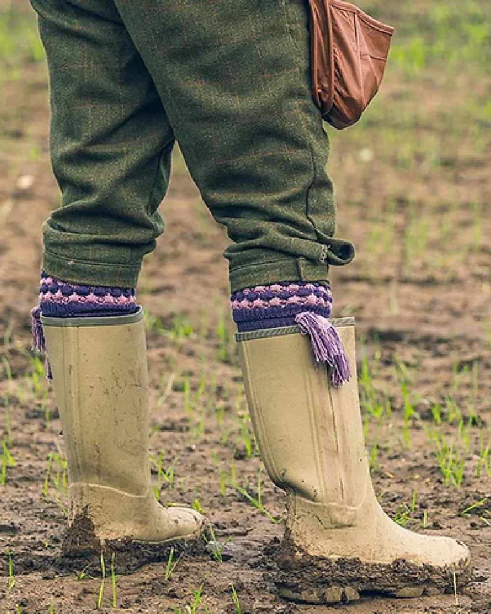 Purple coloured Jack Pyke Pebble Socks on mud background 
