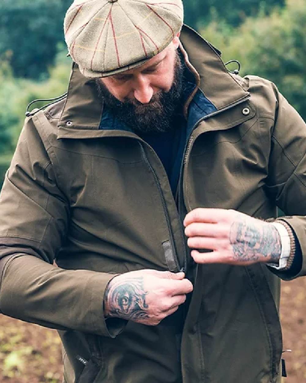 Green coloured Jack Pyke Pro-Lite Hunters Jacket on tree background 