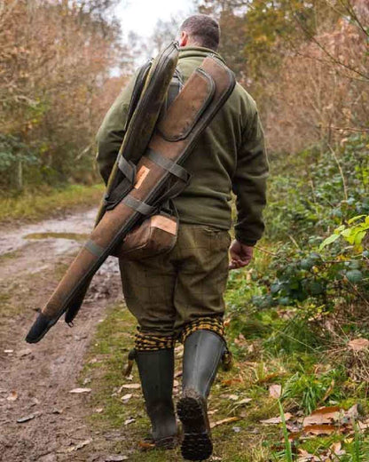 Green coloured Jack Pyke Rifle and Sight Slip Duotex on forest background 