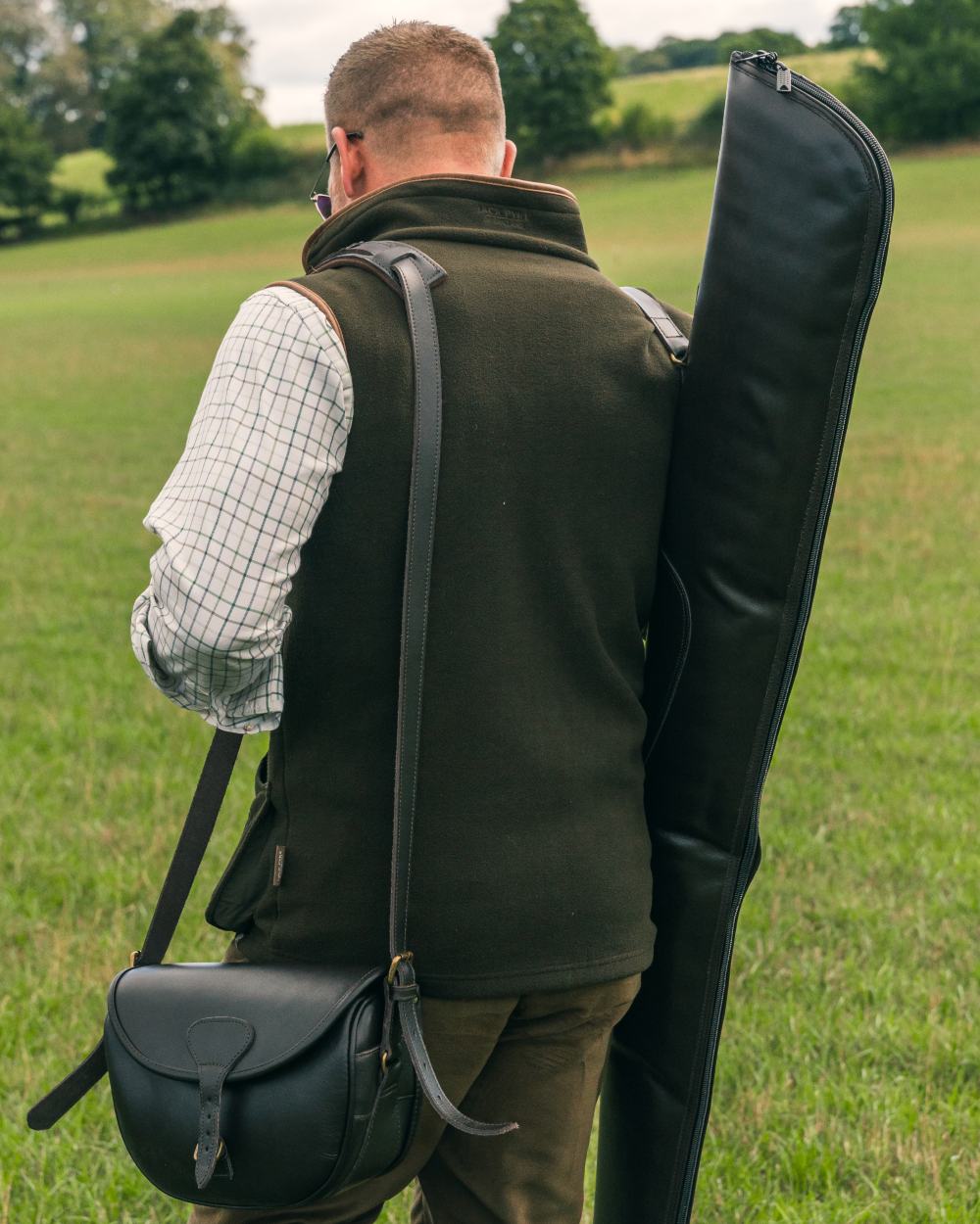 Dark Olive Jack Pyke Shooters Gilet on forest background 