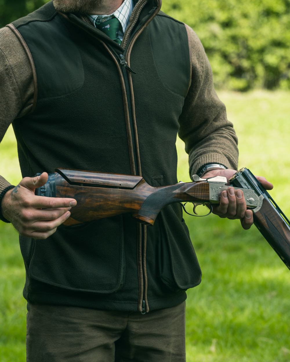 Dark Olive Jack Pyke Shooters Gilet on forest background 