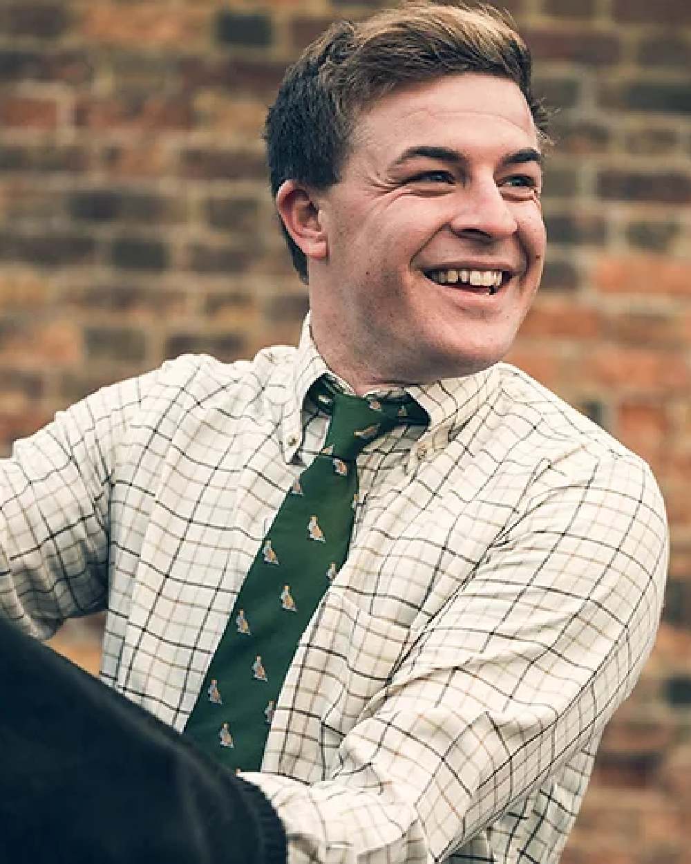 Green coloured Jack Pyke Shooting Tie Partridge on blurry background 