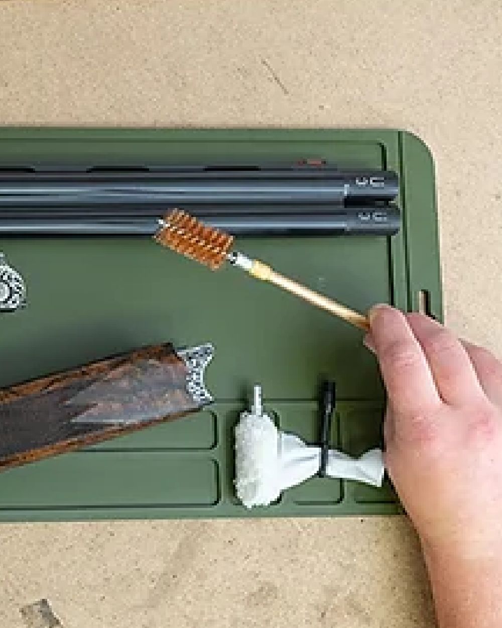 Green coloured Jack Pyke Silicone Gun Maintenance Mat on table background 