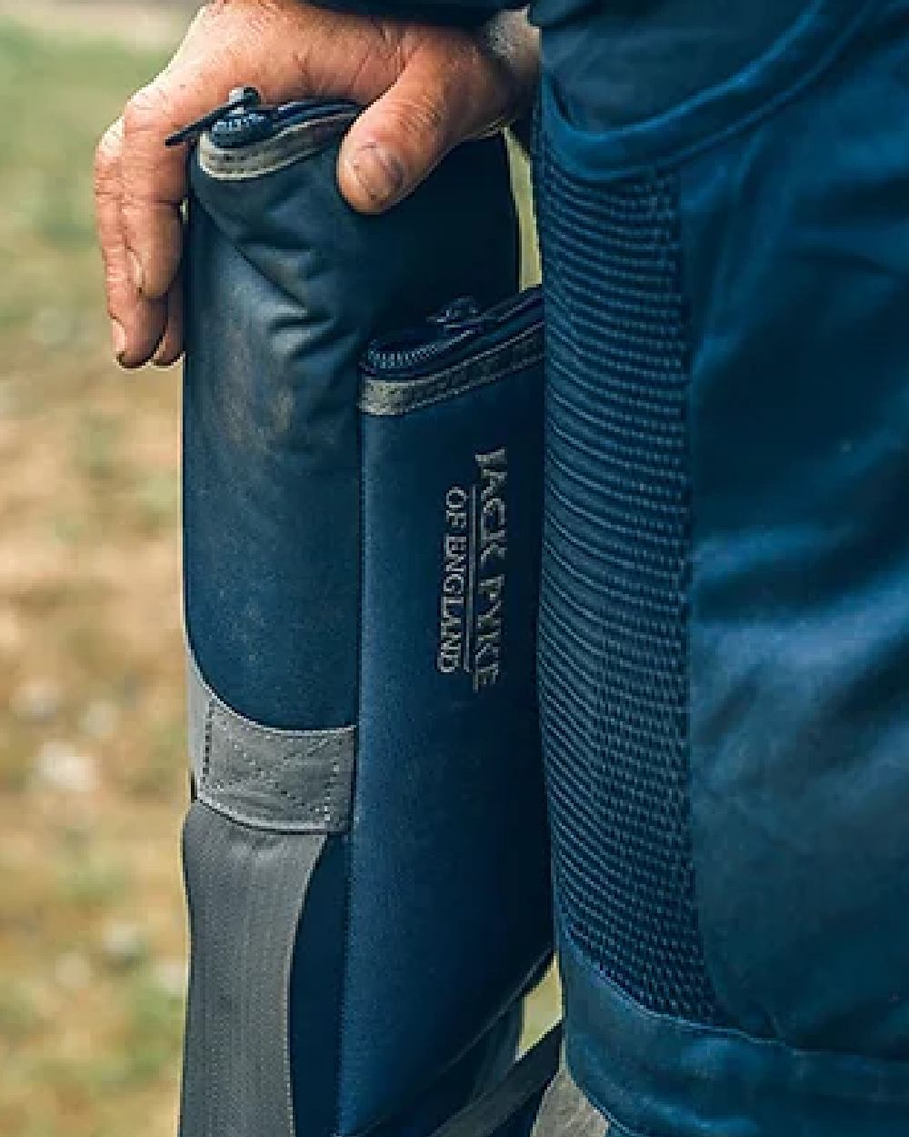 Blue coloured Jack Pyke Sporting Gun Slip on blurry background 