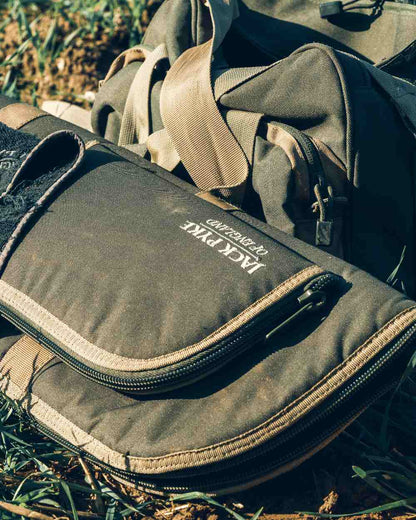 Green coloured Jack Pyke Sporting Gun Slip on forest background 