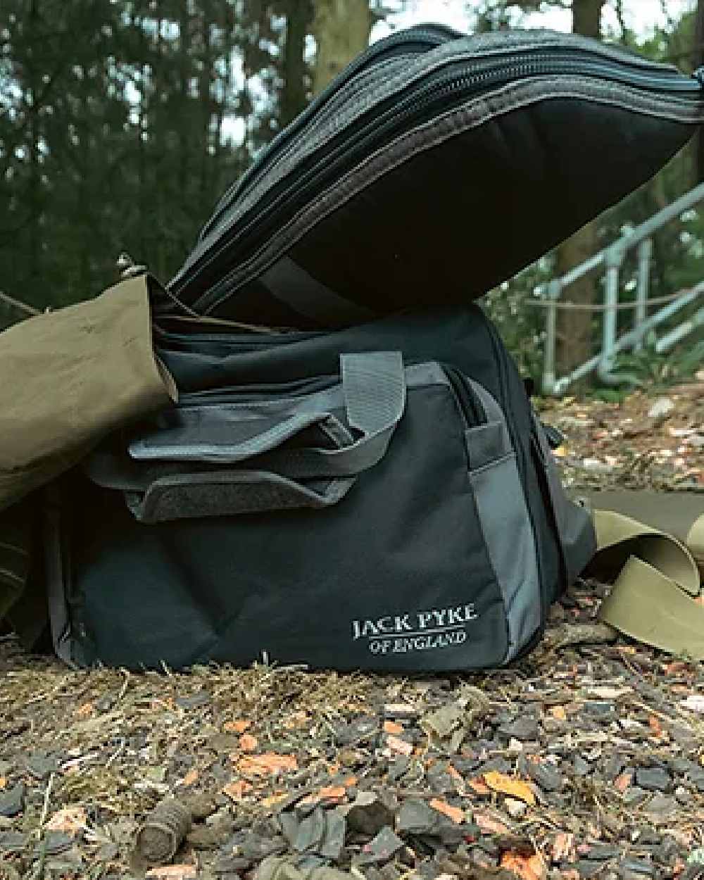 Black coloured Jack Pyke Sporting Shoulder Bag on forest background 