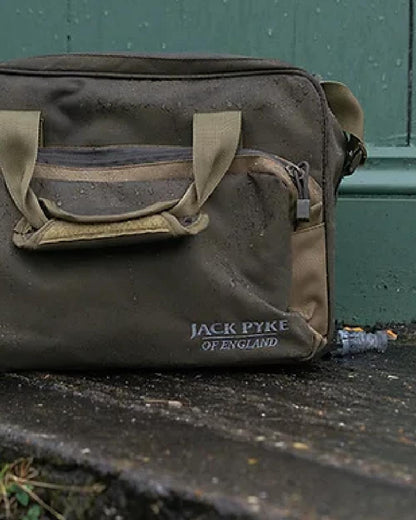 Brown coloured Jack Pyke Sporting Shoulder Bag on door background 