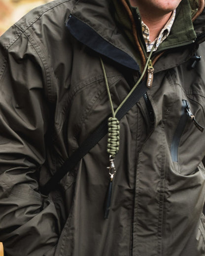 Hunter Green coloured Jack Pyke Technical Featherlite Jacket on mountain background 