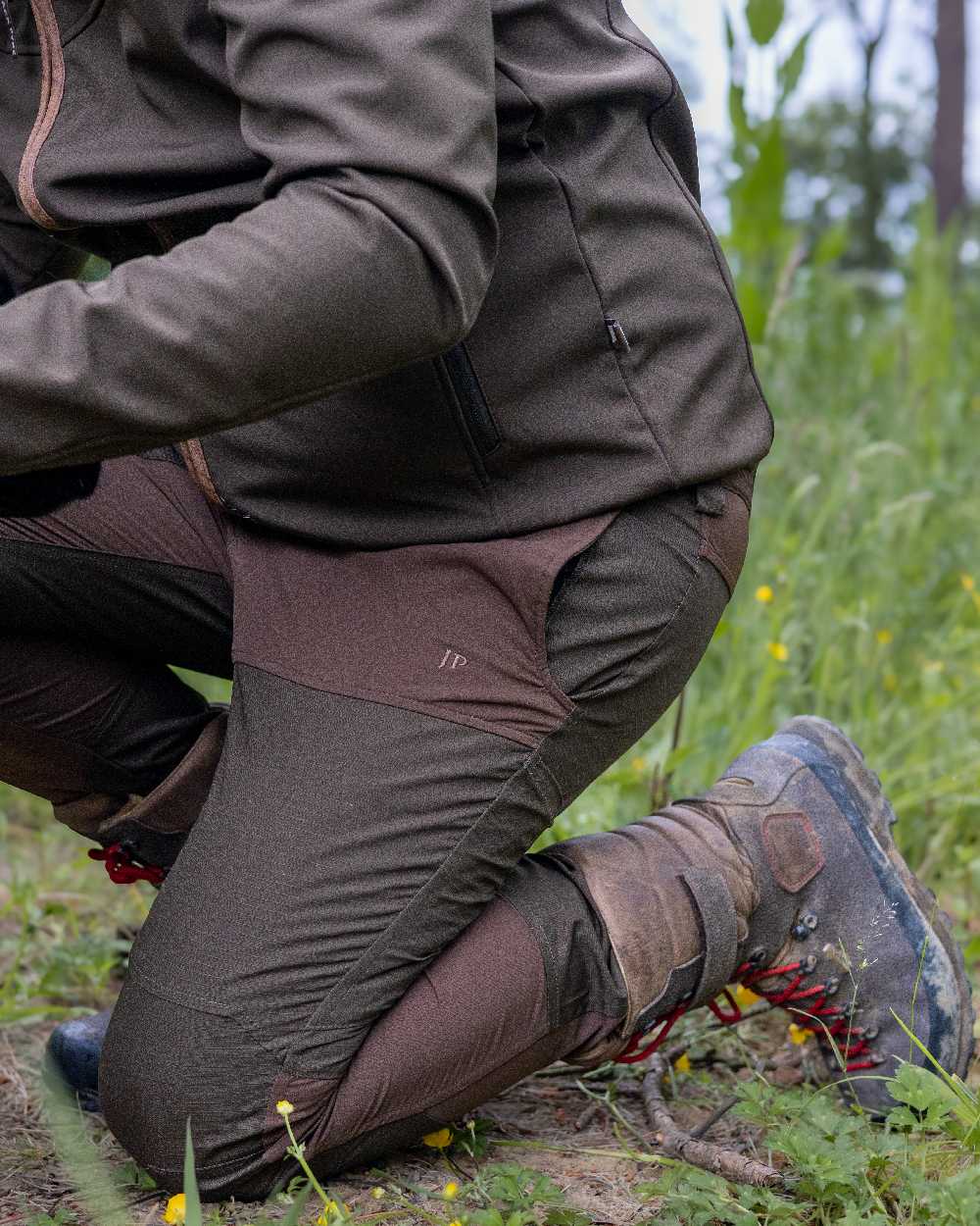 Brown coloured Jack Pyke Technical Hybrid Trousers on outdoor background 