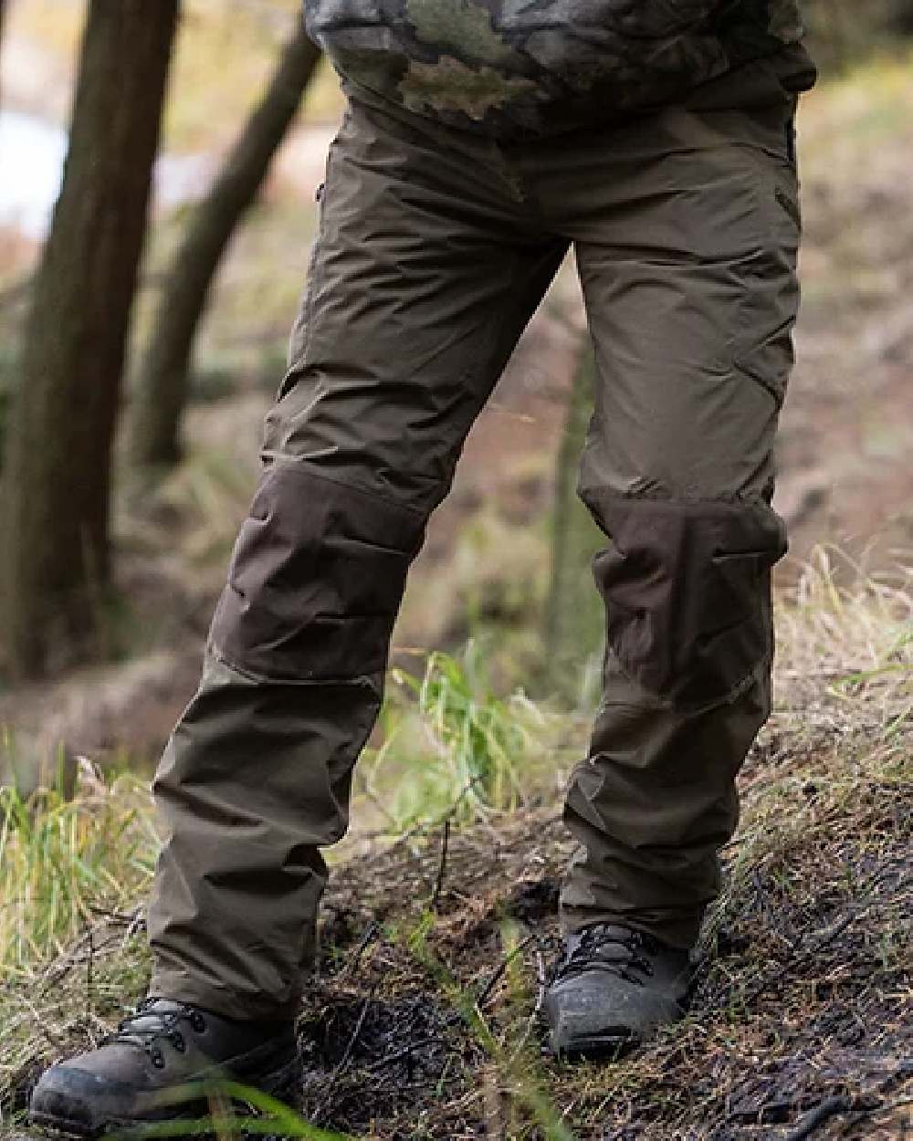 Brown coloured Jack Pyke Weardale Hunting Trousers on forest background 