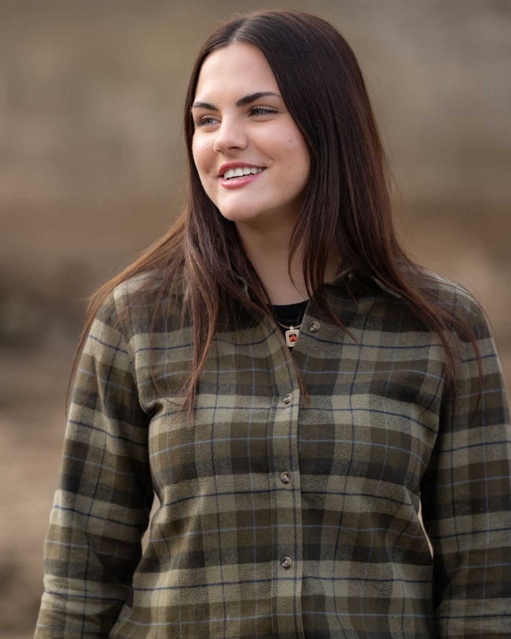 Green coloured Jack Pyke Womens Bleasdale Heavy Flannel Shirt on blurry background 