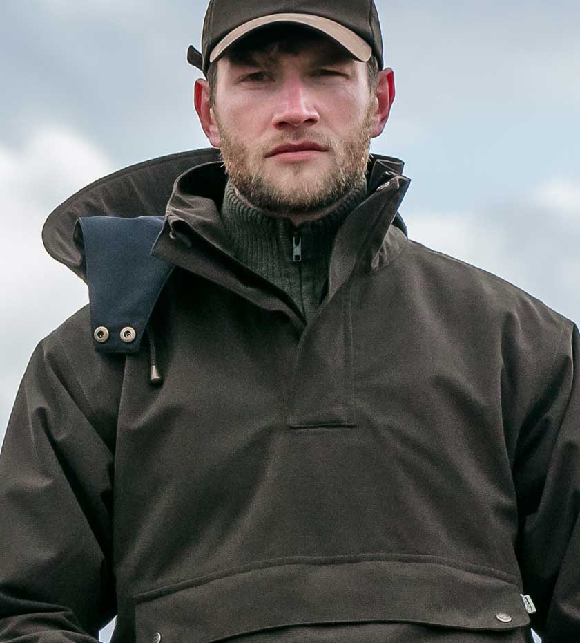 Men's Waterproof country jackets and coats. Man in Green waterproof smock.