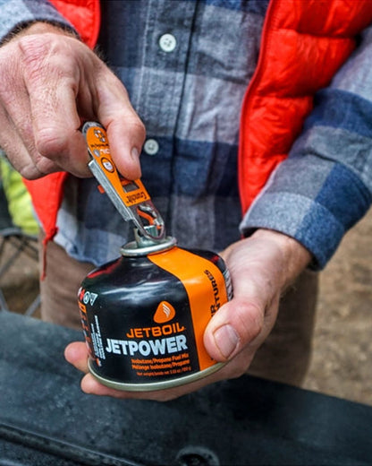 Jetboil Crunchit Fuel Can Recycling Tool on outdoor background