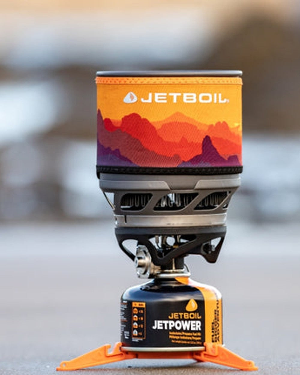 Sunset Coloured Jetboil MiniMo Cooking System on outdoor background 