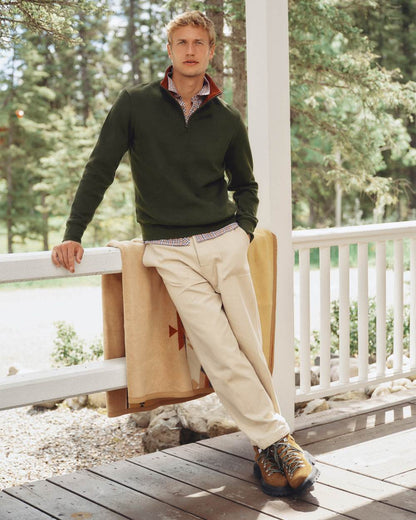 Green coloured Joules Alistair Quarter Zip Cotton Sweatshirt on deck background 