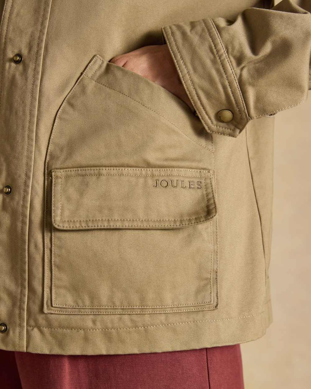 Tan Brown coloured Joules Barn Jacket on tan background 