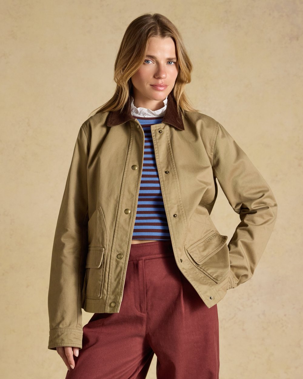 Tan Brown coloured Joules Barn Jacket on tan background 