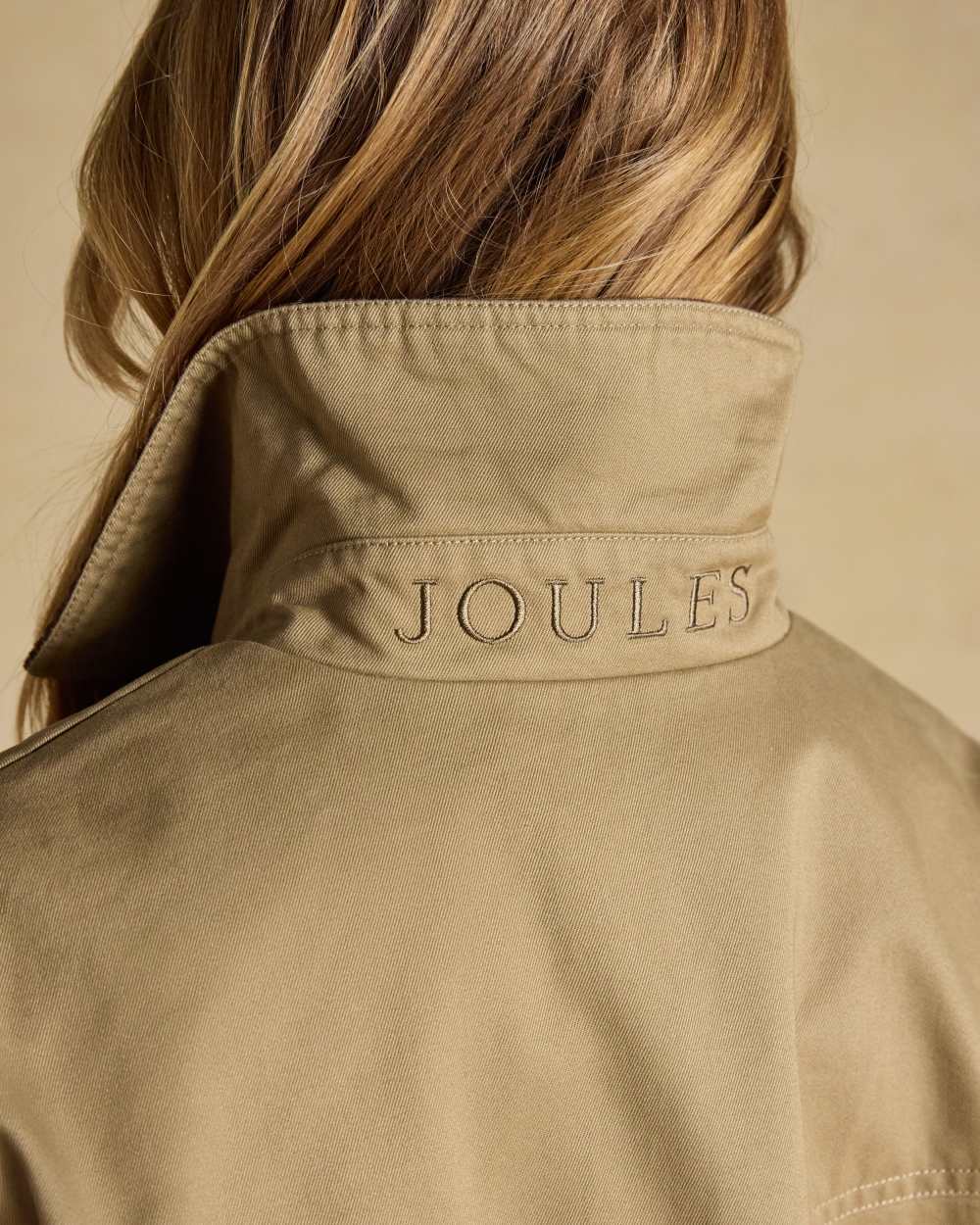 Tan Brown coloured Joules Barn Jacket on tan background 