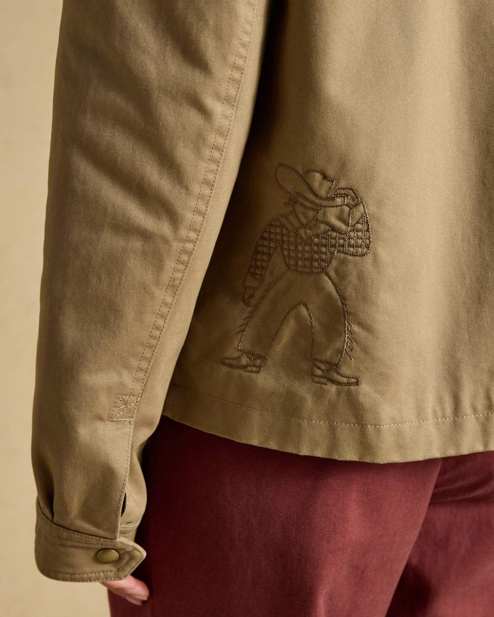 Tan Brown coloured Joules Barn Jacket on tan background 