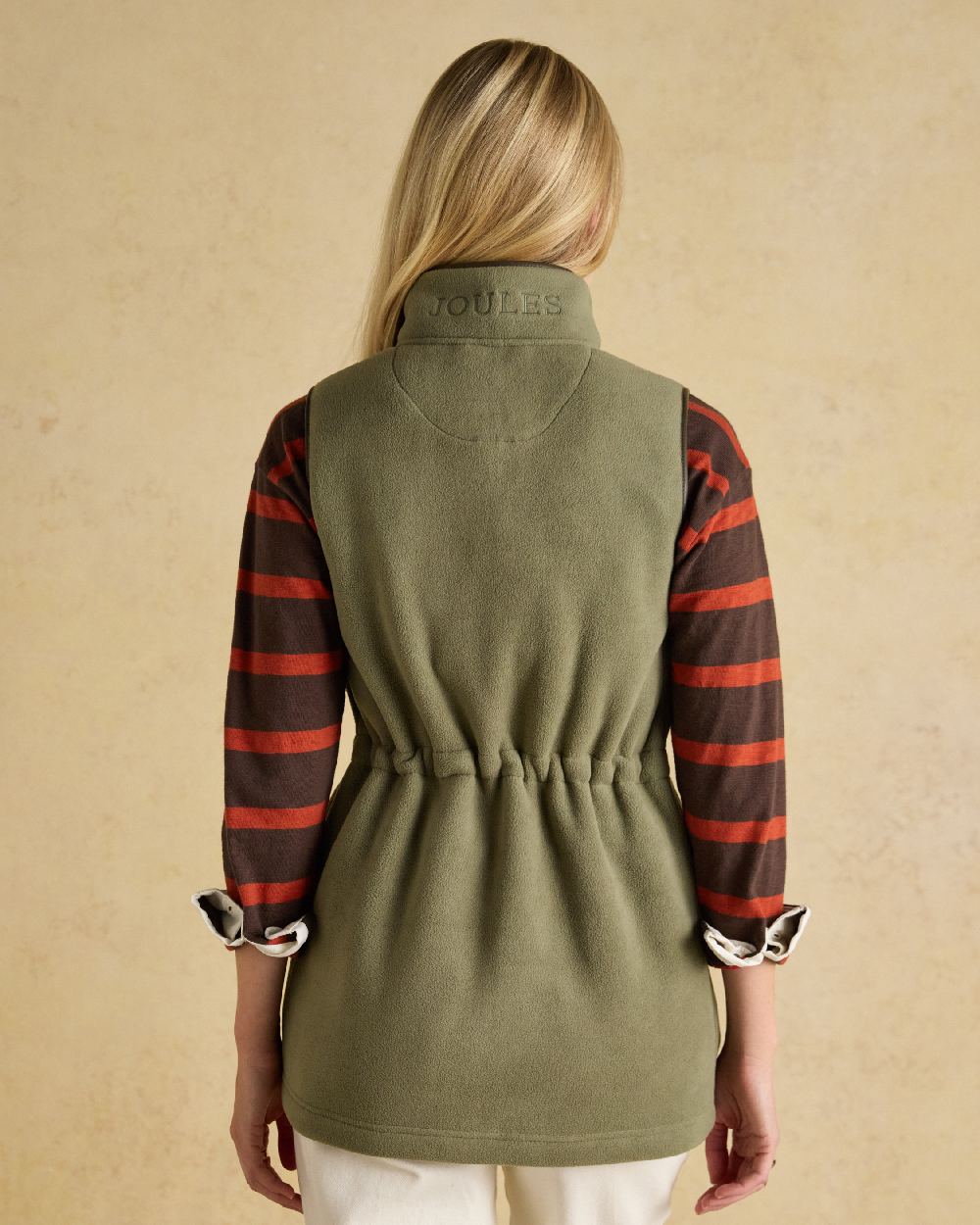 Light Green coloured Joules Heritage Longline Gilet on tan background 