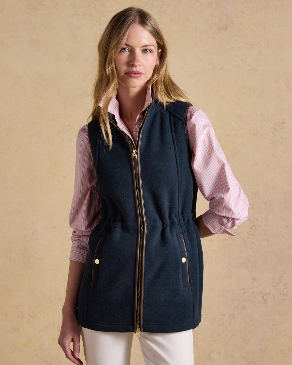 Navy Blue coloured Joules Heritage Longline Gilet on tan background 