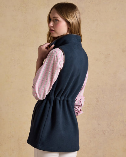 Navy Blue coloured Joules Heritage Longline Gilet on tan background 