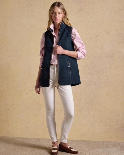 Navy Blue coloured Joules Heritage Longline Gilet on tan background 