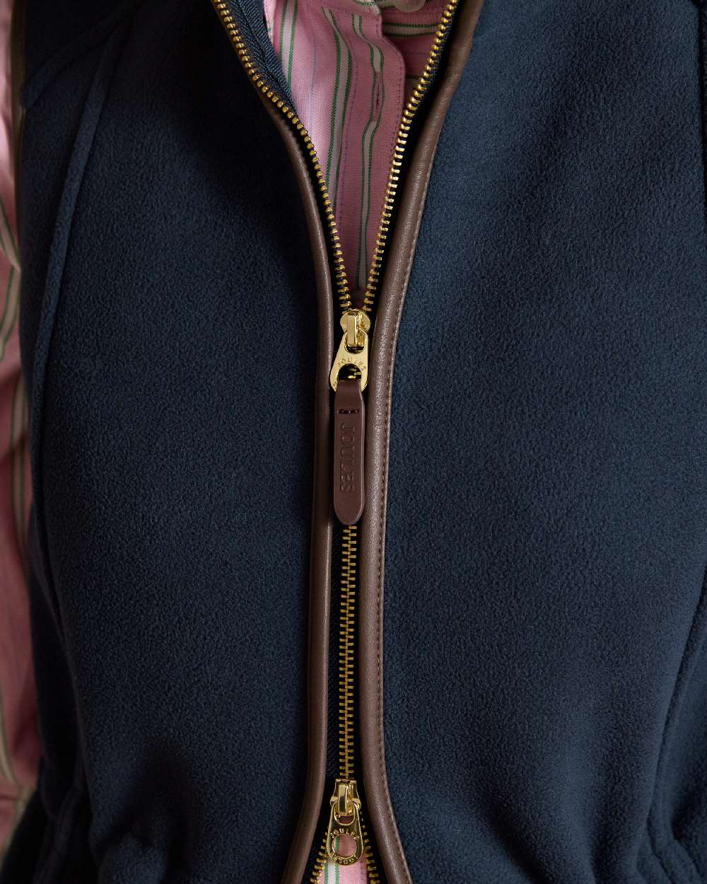 Navy Blue coloured Joules Heritage Longline Gilet on tan background 