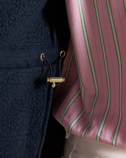 Navy Blue coloured Joules Heritage Longline Gilet on tan background 